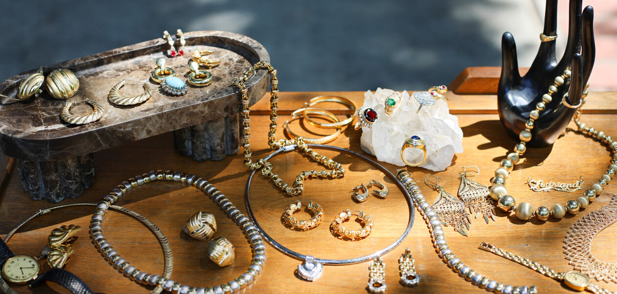 Jewelry beautifully displayed on a wood tabletop 